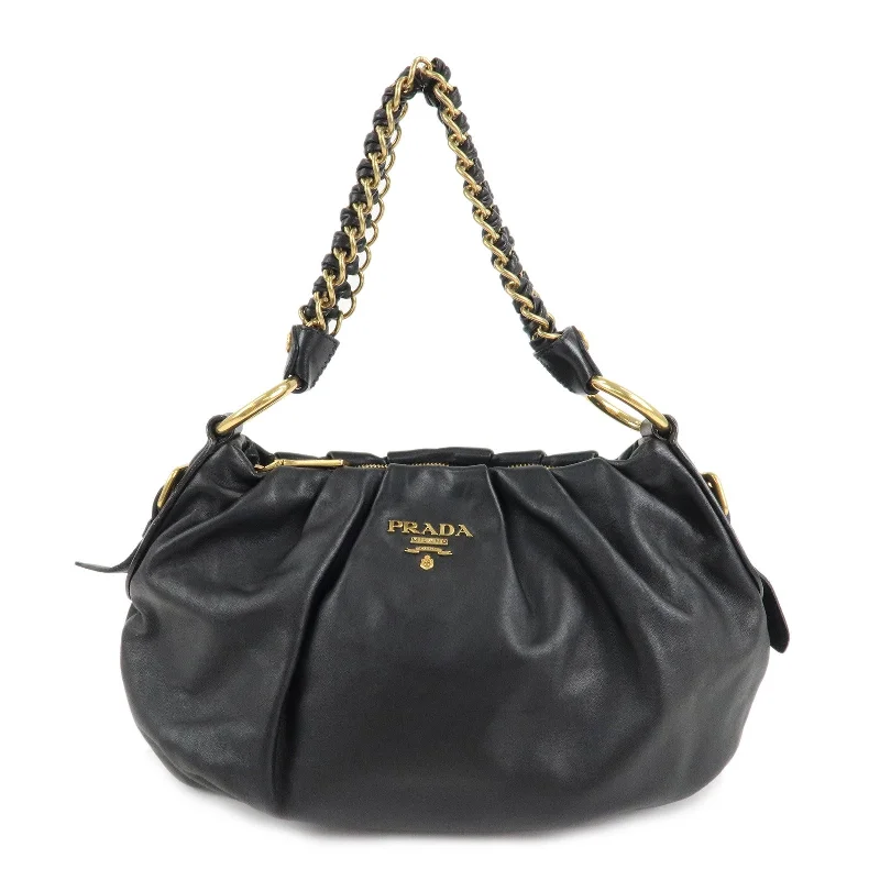 Prada nylon backpacks with a sleek, minimalist appearancePRADA Leather Chain One-Shoulder Bag Black Gold Hardware