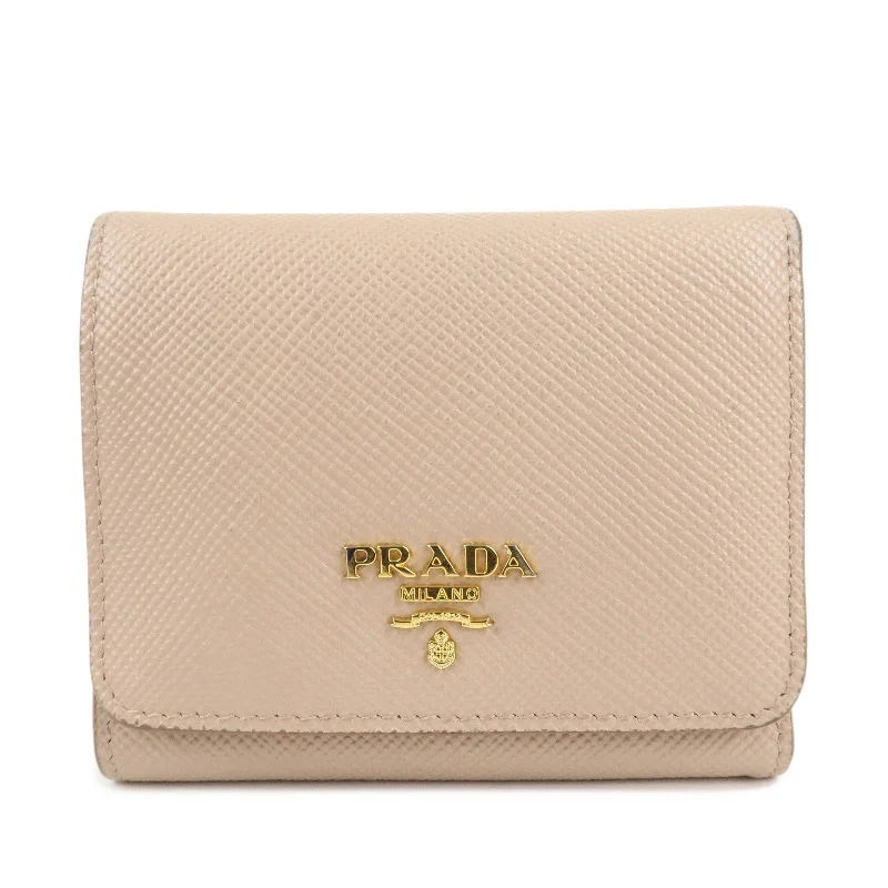 Prada Cleo bags with a contrast - colored interior for visual interestPRADA Saffiano Leather Trifold Compact Wallet Beige 1MH176