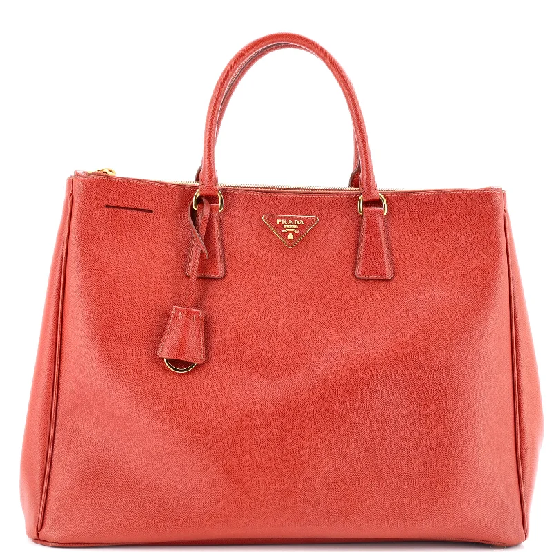 Prada Cahier bags featuring the signature triangular logo plaqueDouble Zip Lux Tote Saffiano Leather Large