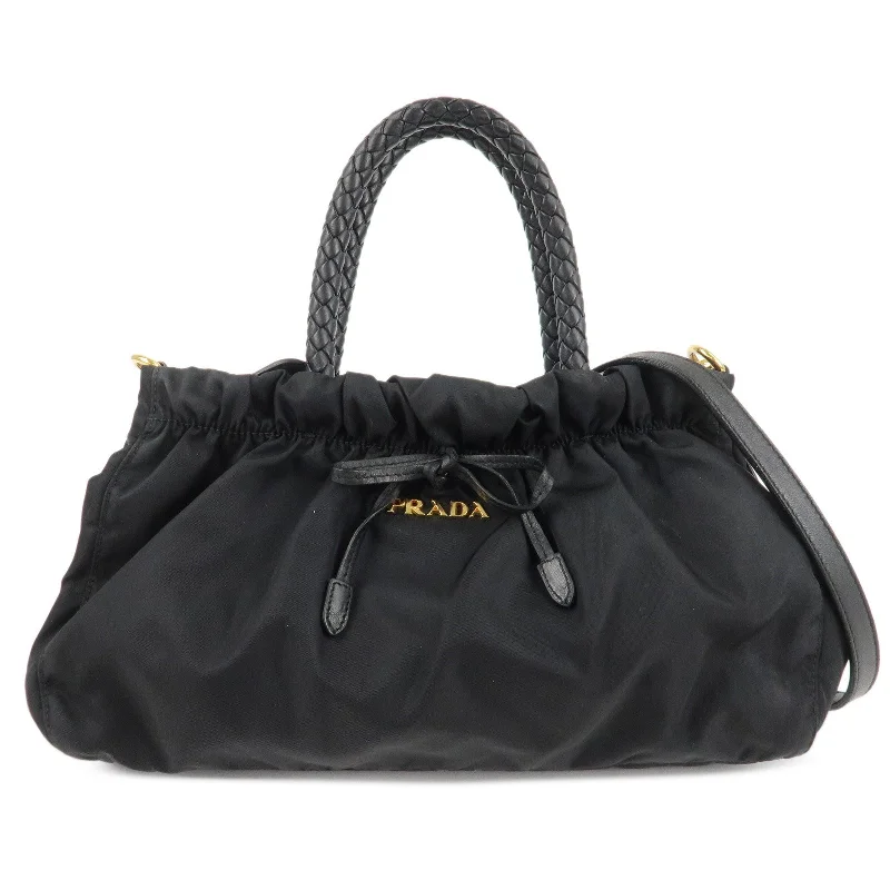 Prada tote bags with a printed Prada logo on the front for brand visibilityPRADA Nylon Leather Ribbon 2Way Shoulder Bag Black BN1631