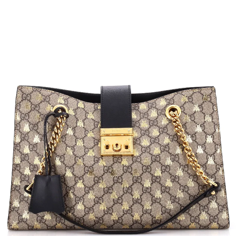 Women Gucci Sylvie bags with a crystal - embellished web stripePadlock Chain Tote Printed GG Coated Canvas Medium