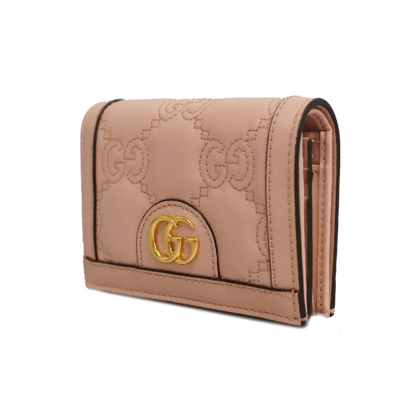 Women Gucci bags with a snap - button closure and a decorative charmGucci GG Matelasse 723786 Women's Leather Wallet (bi-fold) Pink