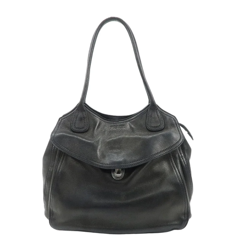 Prada tote bags with a double - handle and shoulder - strap option for easy usePRADA Leather Tote Bag Black