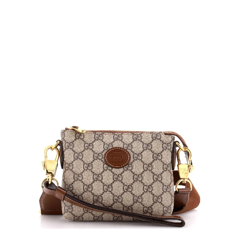 Women Gucci Sylvie bags with a leather - wrapped handleInterlocking G Patch Wristlet Messenger Bag GG Coated Canvas Mini