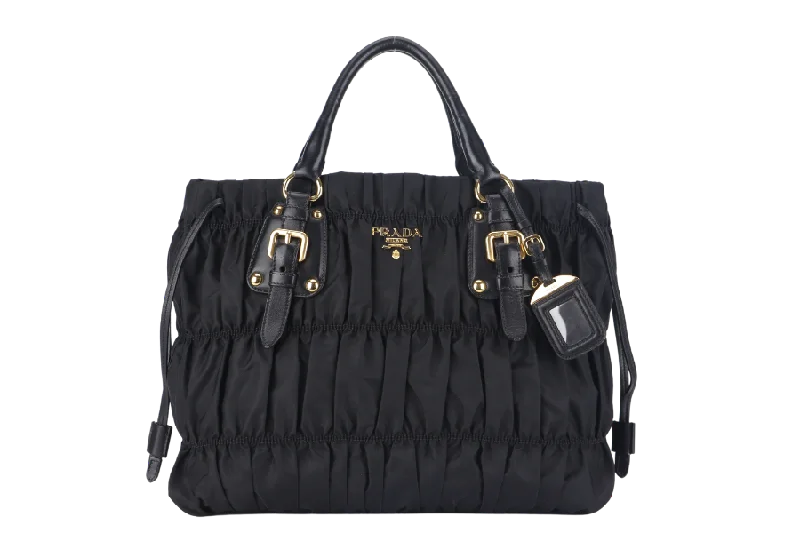 Prada Cahier bags with a monogram - embossed leather surfacePRADA TESSUTO GAUFRE (BN1788) NYLON NERO WITH STRAP AND DUST COVER