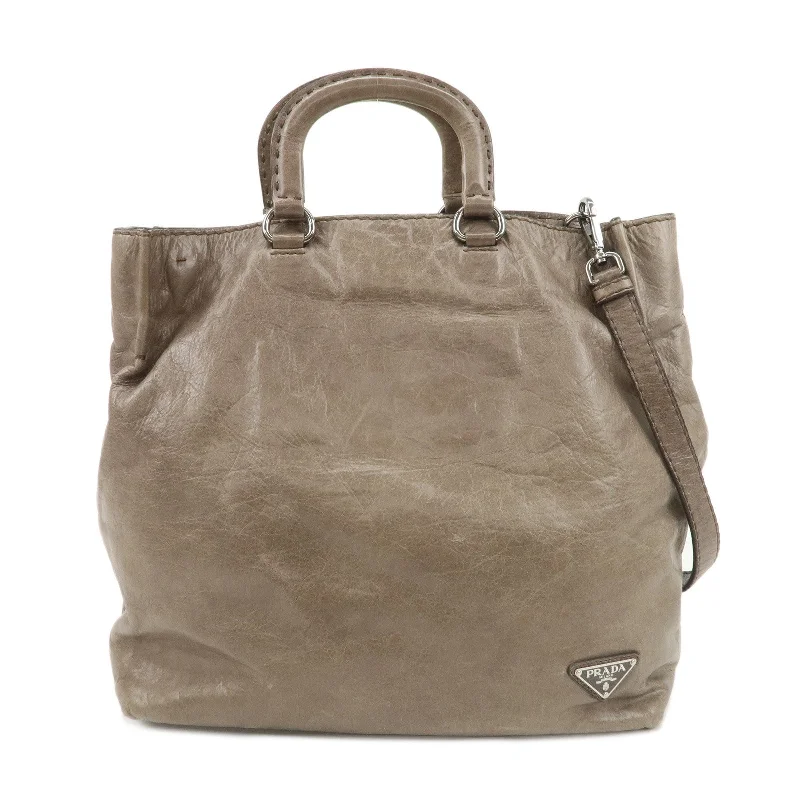 Prada Cleo bags with a detachable coin purse for added functionalityPRADA Logo Leather 2Way Bag Tote Bag Shoulder Bag Beige BR4617