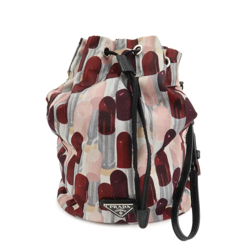 Prada Cahier bags featuring the signature triangular logo plaqueAuthPRADA Logo Nylon Drawstring Pouch Lip Stick Print White Pink Red