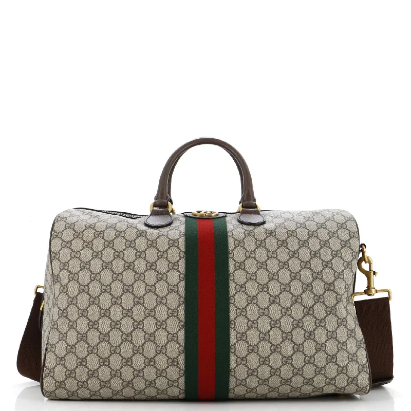 Women Gucci bags with a snap - button closure and a decorative charmOphidia Carry On Duffle Bag GG Coated Canvas Medium