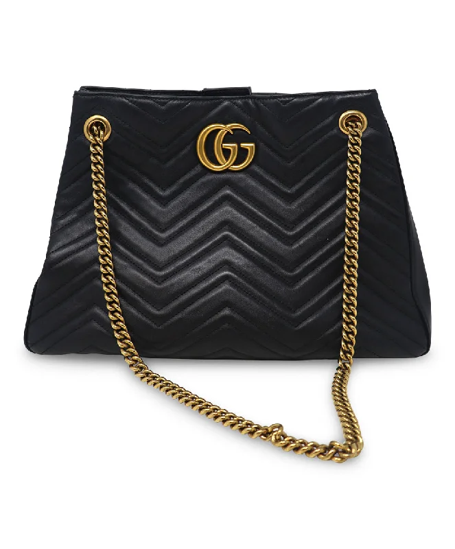 Women Gucci bags with a chain - link trim and a leather bodyGucci Quilted Black Leather Marmont Tote