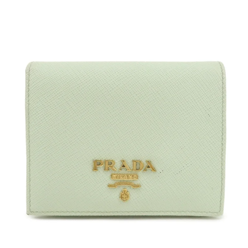 Prada nylon backpacks with a sleek, minimalist appearancePRADA Logo Saffiano Leather Bi-Fold Small Wallet Light Green