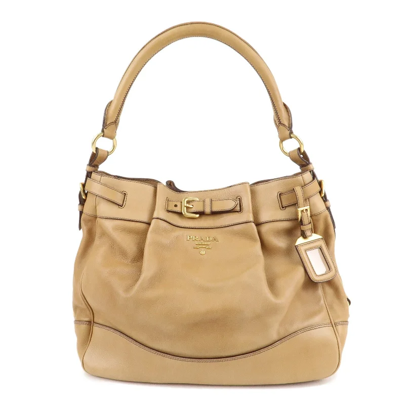 Prada bags with a snap - button closure and a decorative charm for a fashionable lookPRADA Leather One Shoulder Bag Brown