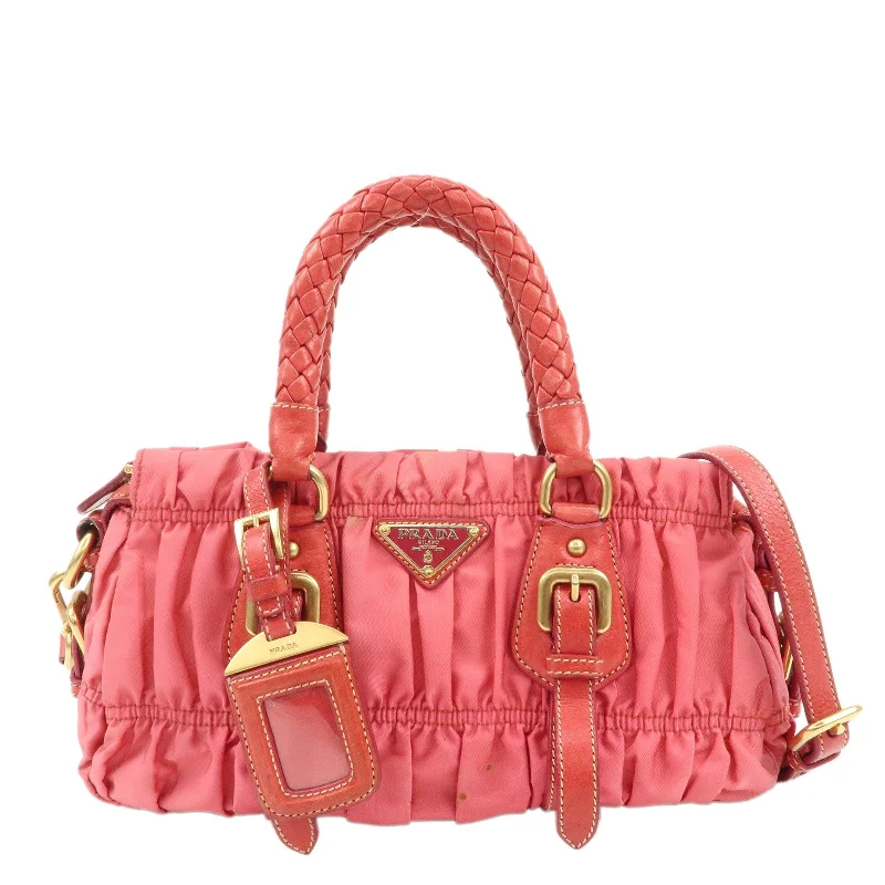 Prada Cleo bags with a contrast - colored interior for visual interestPRADA Nylon Leather 2Way Bag Shoulder Bag Hand Bag Gathered BN1388