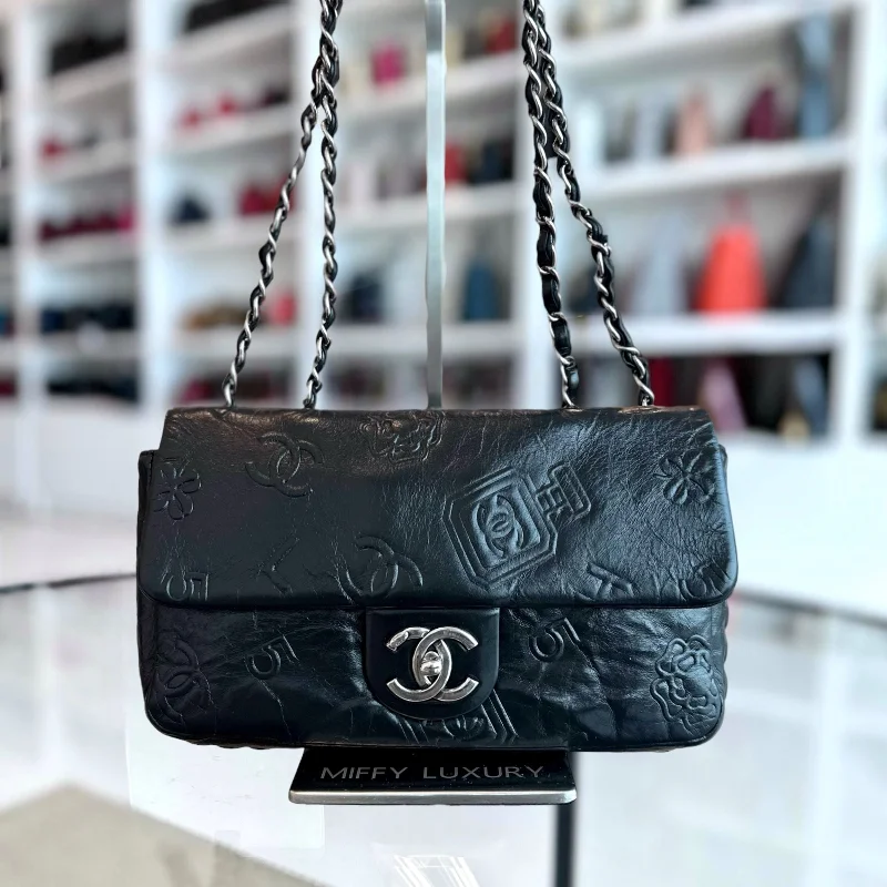 Chanel bags with gold, silver, and pearl accentsSeasonal Flap Previous Symbols Flap Bag Embossed Calfskin Black SHW No 19