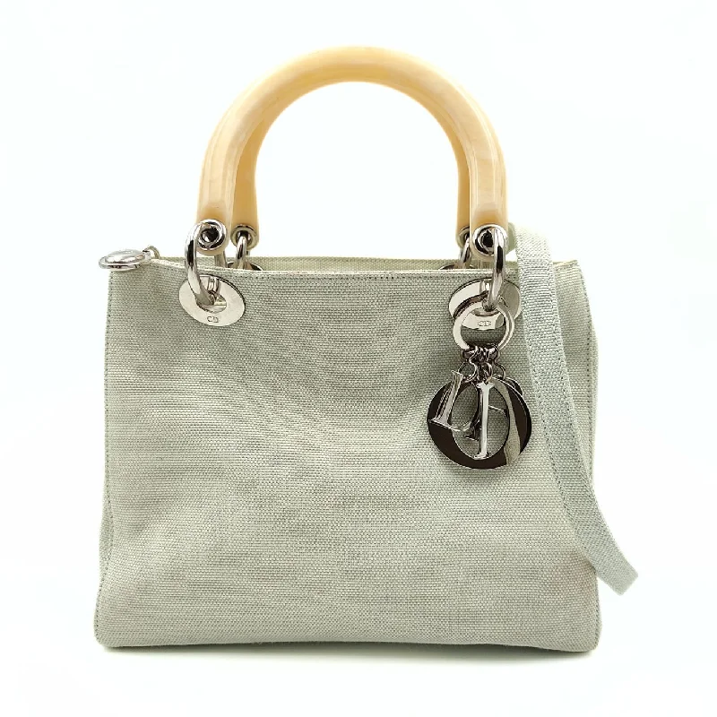 Contemporary Christian Dior handbags with a unique shapeChristian Dior Christian Lady bag in pastel water green canvas