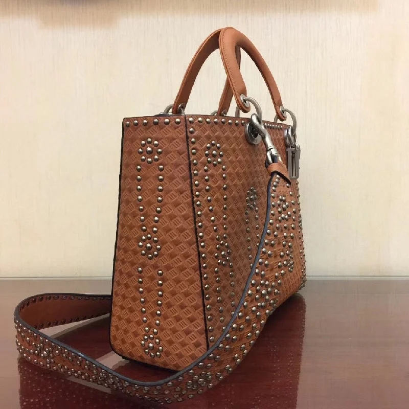 Christian Dior Saddle bags with a distressed leather finishDior Large Lady Dior Bag In Brown Studded Calfskin