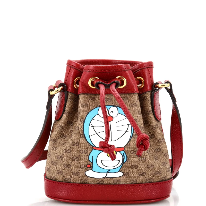 Women Gucci bags with a magnetic snap closure for easy accessDoraemon Bucket Bag Printed Mini GG Coated Canvas Mini