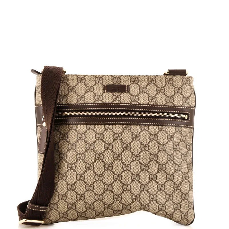 Women Gucci Sylvie bags featuring the signature web stripeFront Zip Flat Messenger Bag GG Coated Canvas Medium