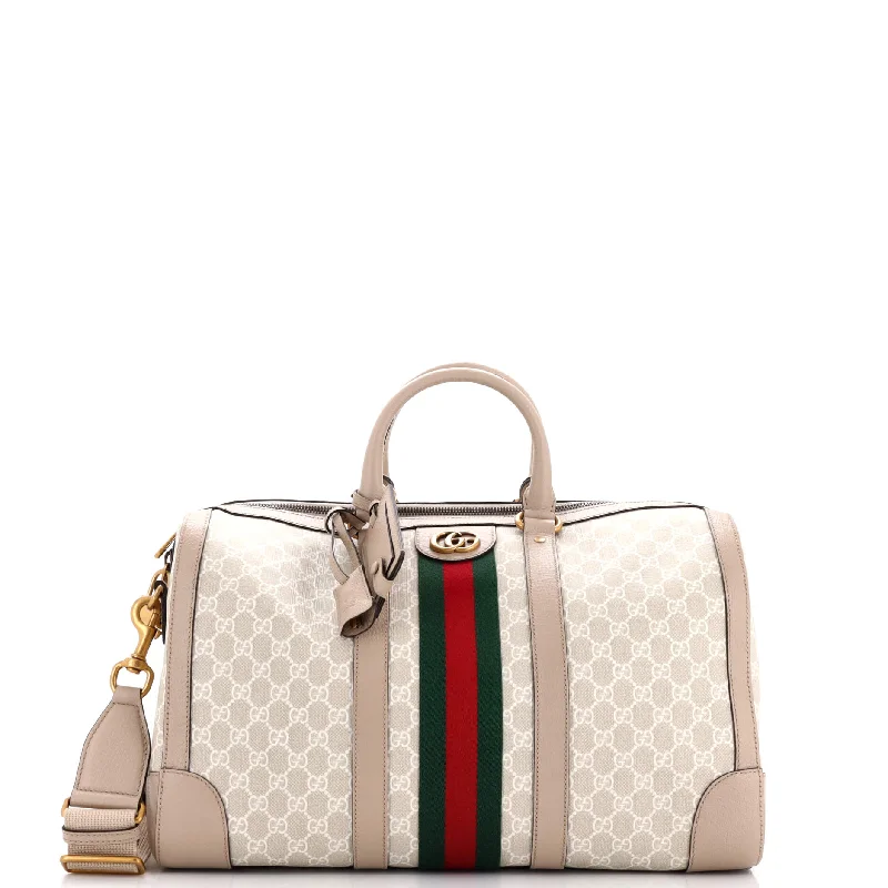 Women Gucci Sylvie bags featuring the signature web stripeSavoy Web Convertible Duffle Bag GG Coated Canvas Small