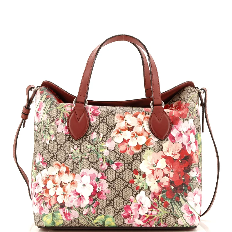 Women Gucci Sylvie bags with a crystal - embellished web stripeSignature Fold Over Tote Blooms Print GG Coated Canvas Medium